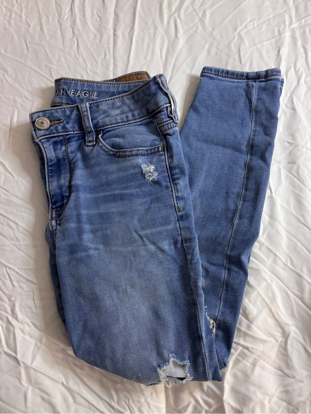 American Eagle Outfitters Light Blue Skinny Jeans with Distressed Details